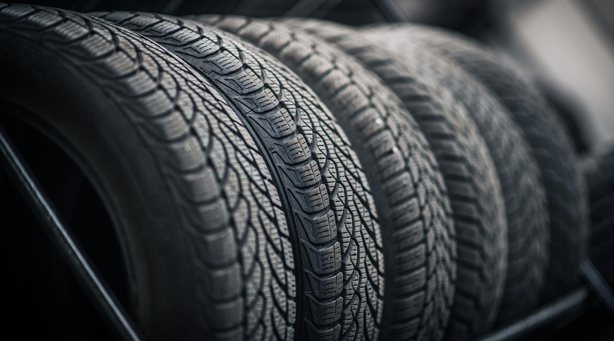 Row of new tires on a rack